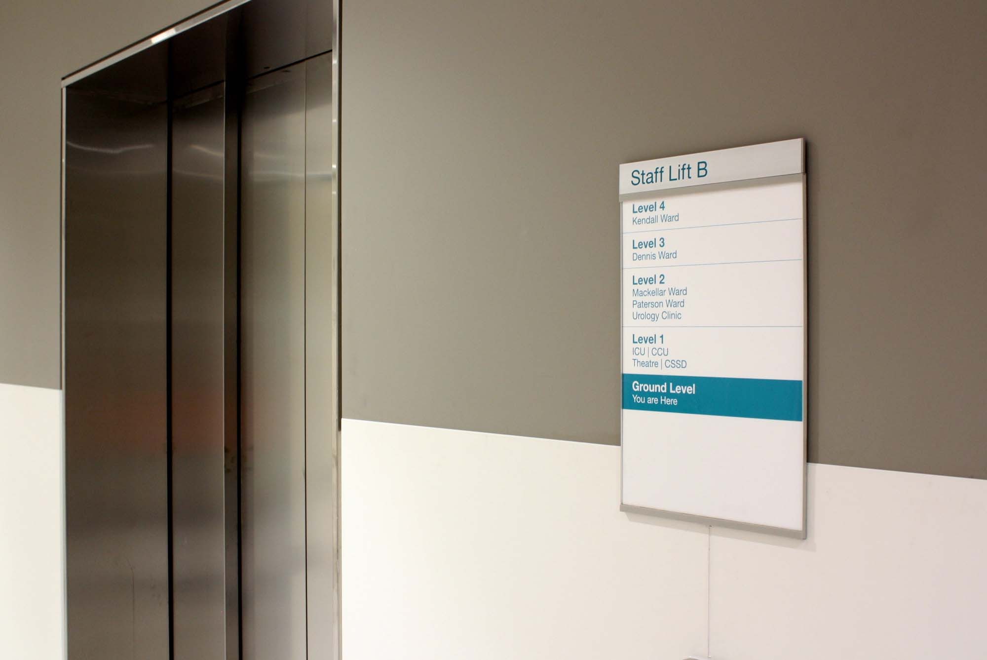 Poster Holder Series installed with an architectural aluminum header